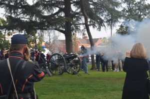 People watch in Smiley Park as the 1st Pennsylvania Light Artillery fire a cannon at the 2014 Open House. Smoke is seen coming from the barrel.